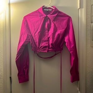 Small hot pink long sleeved crop top with waist straps